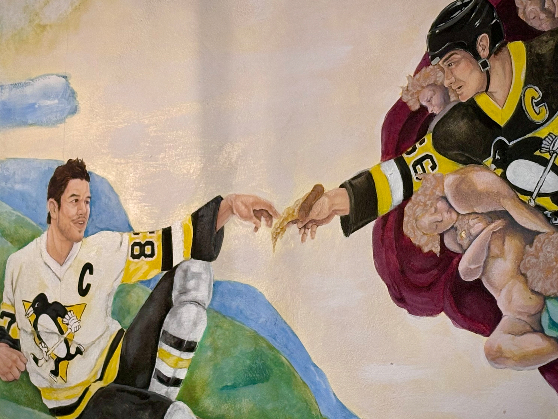 A hockey-themed parody of Michelangelo's The Creation of Adam features two players in Pittsburgh Penguins uniforms.